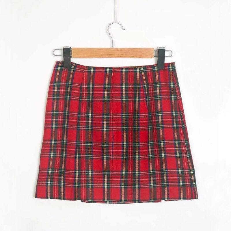 Red plaid pencil skirt with pleats, featuring a stylish grunge design, perfect for chic outfits and standout fashion.