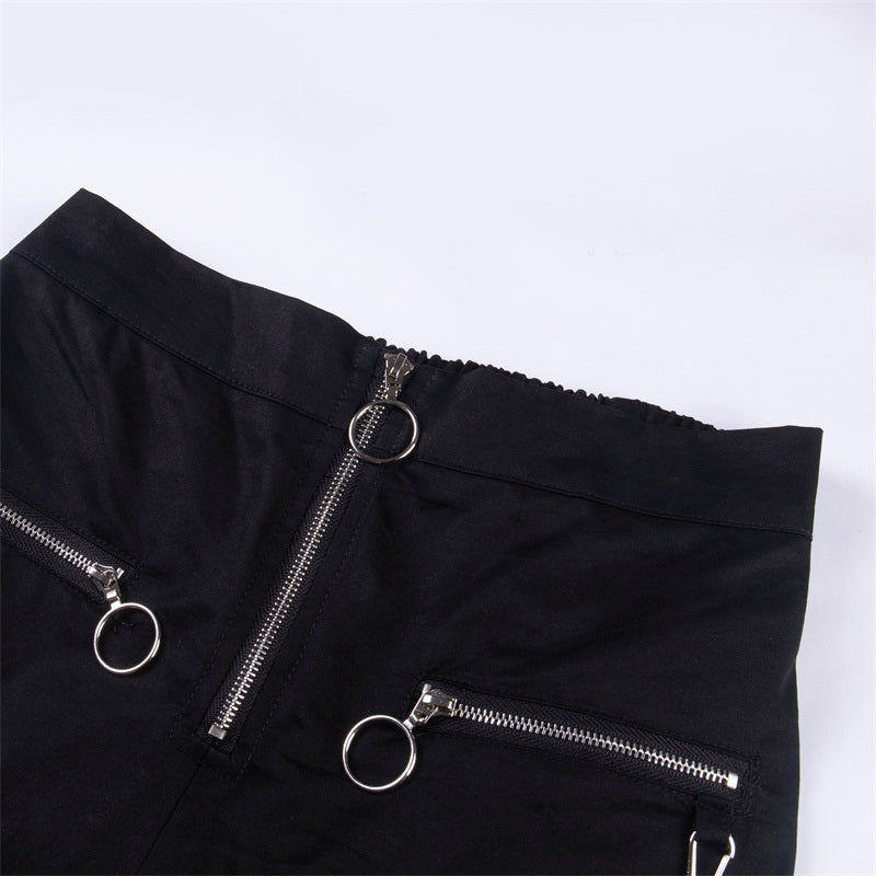 Close-up of solid black streetwear pants featuring zippers and chains, perfect for gothic fashion lovers.