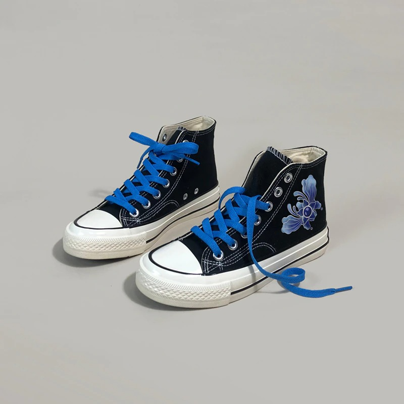 Stylish women's aesthetic sneakers with blue laces and floral graffiti design, perfect for casual outfits.