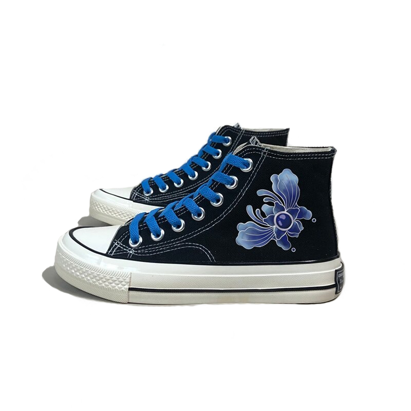 Stylish women's aesthetic sneakers in black canvas with vibrant blue laces and floral graffiti design.