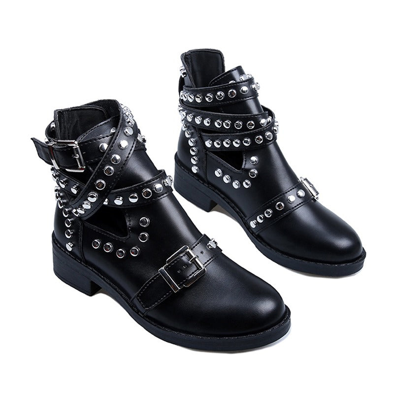 Women's rock style ankle boots with rivets and buckles, featuring chunky heels and a bold design.