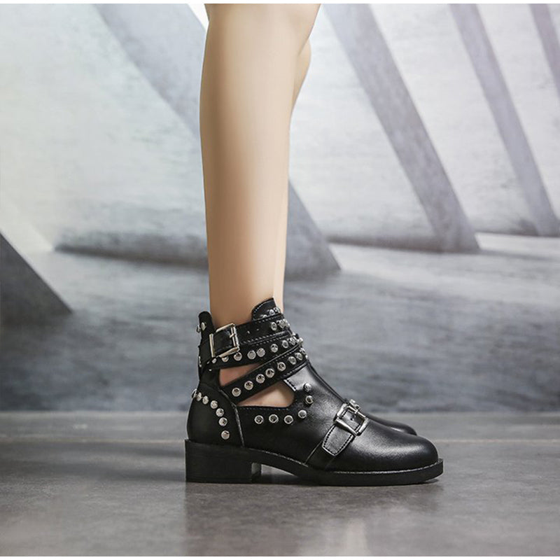 Women's chunky heel ankle boots with leather buckle strap and rivets, perfect for a stylish rock look.