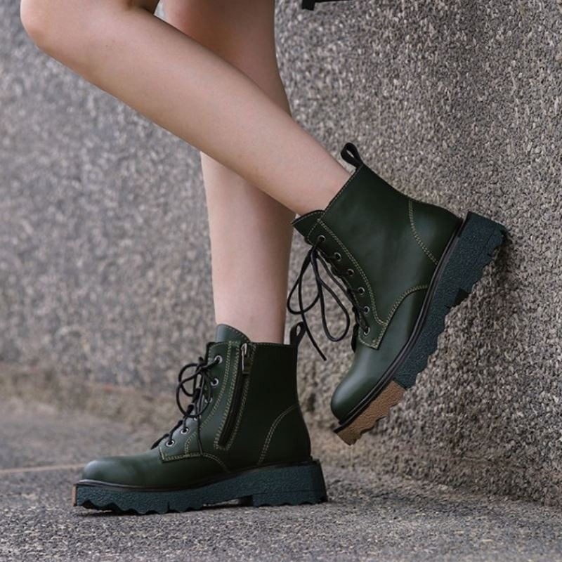 Stylish women's real leather ankle boots in dark green with zipper and laces, perfect for trendy outfits.