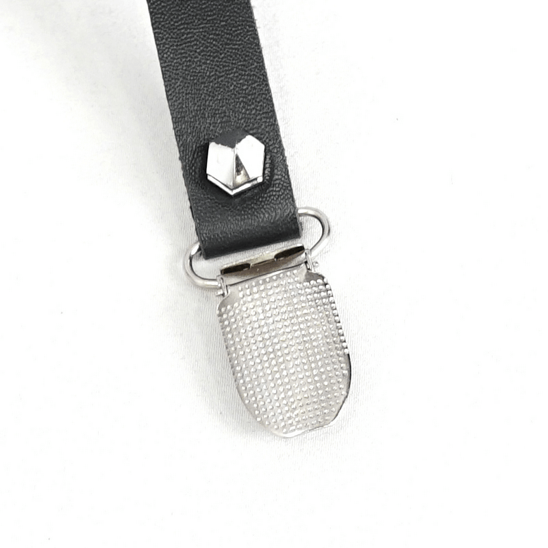 Close-up of a stylish black strap with a silver clip and a unique metal heart-shaped detail.