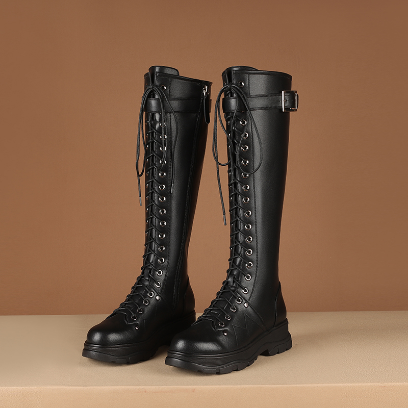 Stylish women's knee-high motorcycle boots in genuine leather with lace-up design and square platform heel.