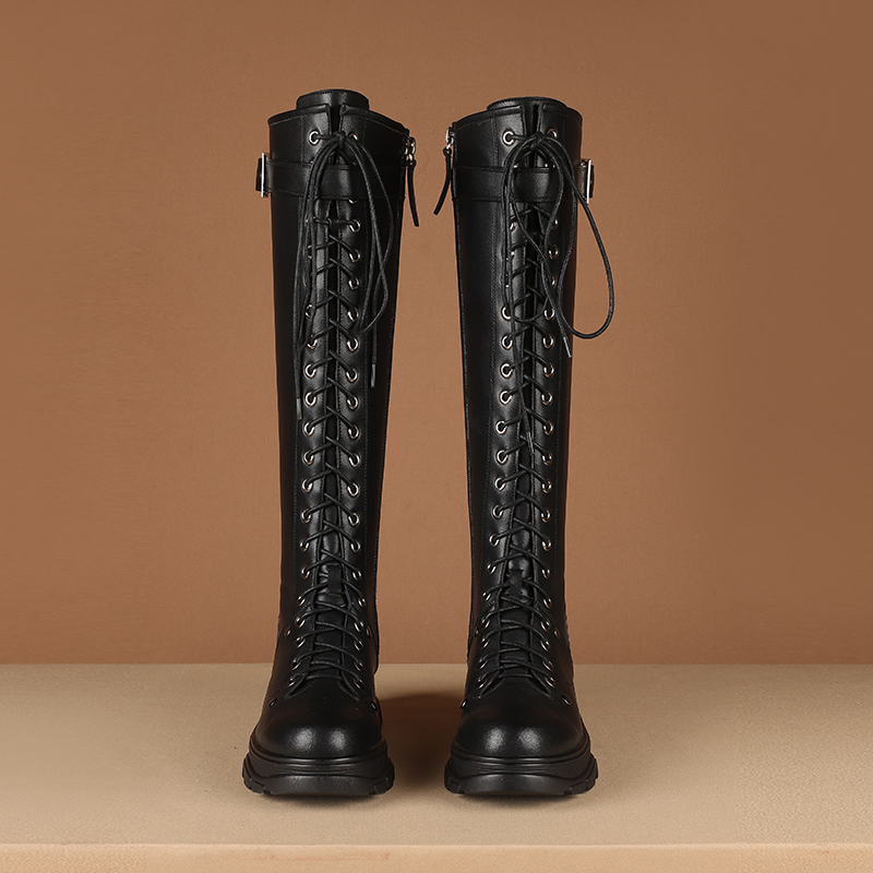 Stylish women's knee-high motorcycle boots in black genuine leather with lace-up design and square heel platform.