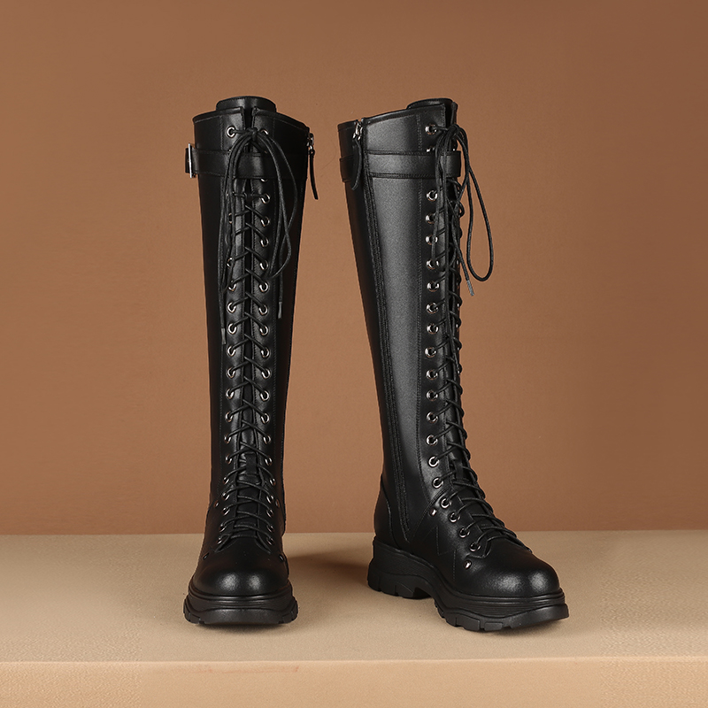 Black knee-high motorcycle boots with laces and square heel platform, made from genuine leather for women.