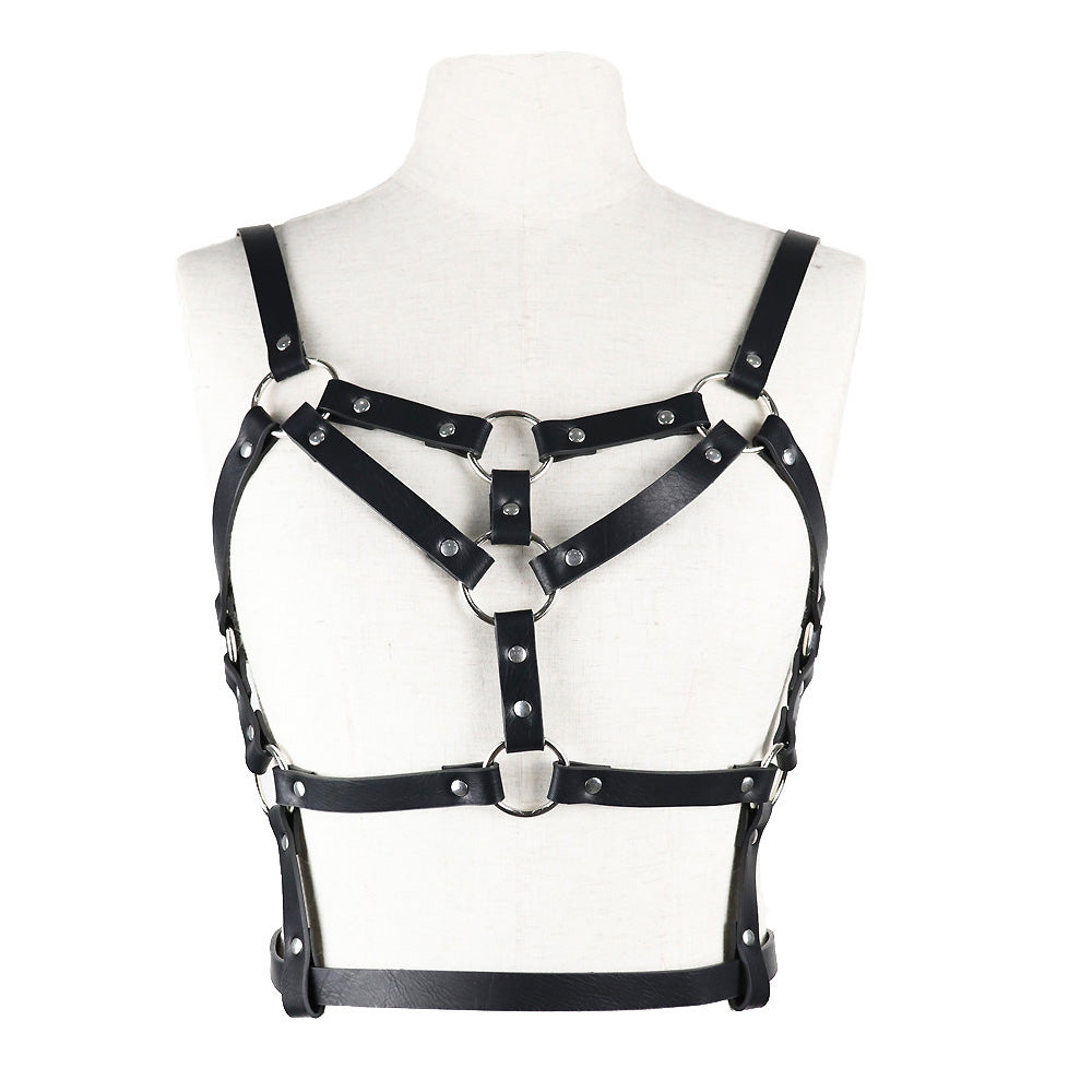 Women's adjustable faux leather body harness for stockings, featuring metal rivets and rings for a sexy look.