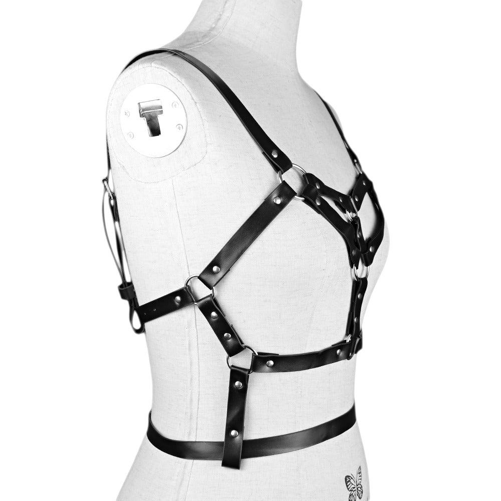 Women's adjustable faux leather harness belt with metal rivets on mannequin, perfect for stockings.