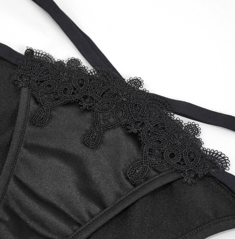 Close-up of women's black bikini with gothic lace appliqué, showcasing elegant detail and stylish design.