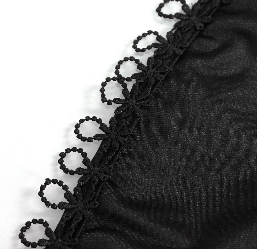 Close-up of black bikini fabric with delicate lace appliqué trim, showcasing gothic elegance and style.