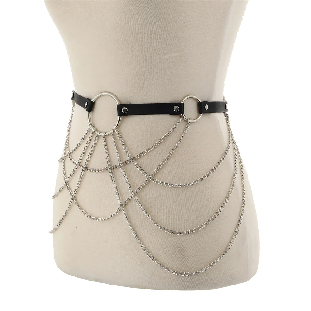 Stylish women's black leather body harness with silver chain in gothic style, perfect for alternative fashion.