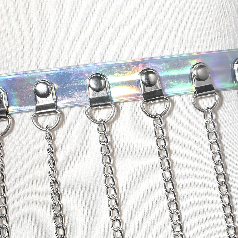 Women's gothic body harness with metallic chains and iridescent faux leather waist belt alternative fashion accessory.