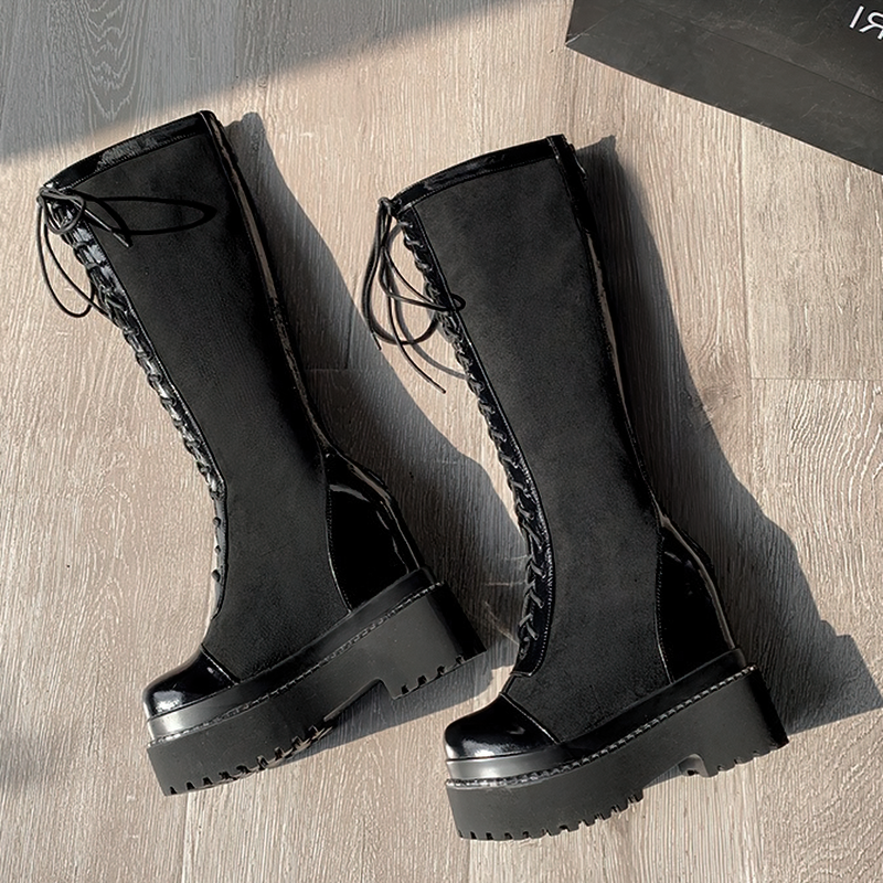 Stylish women's black over-the-knee boots with thick bottom and high lacing in British style.