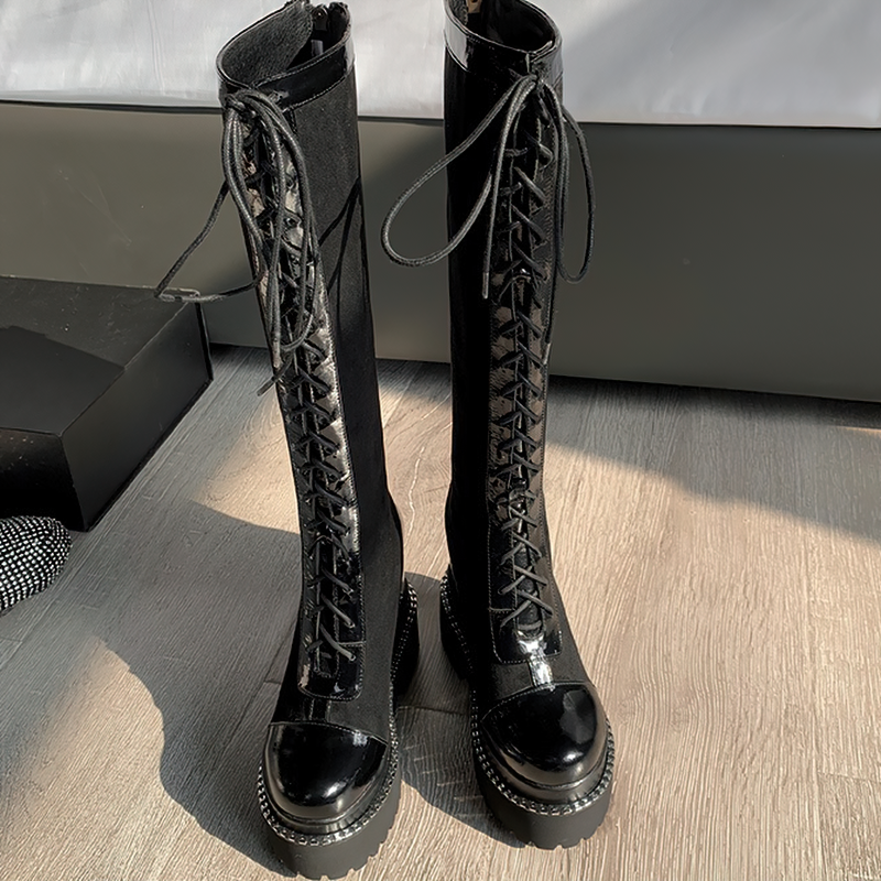 Women's black over-the-knee boots with thick soles and high lacing, perfect for stylish rock outfits.