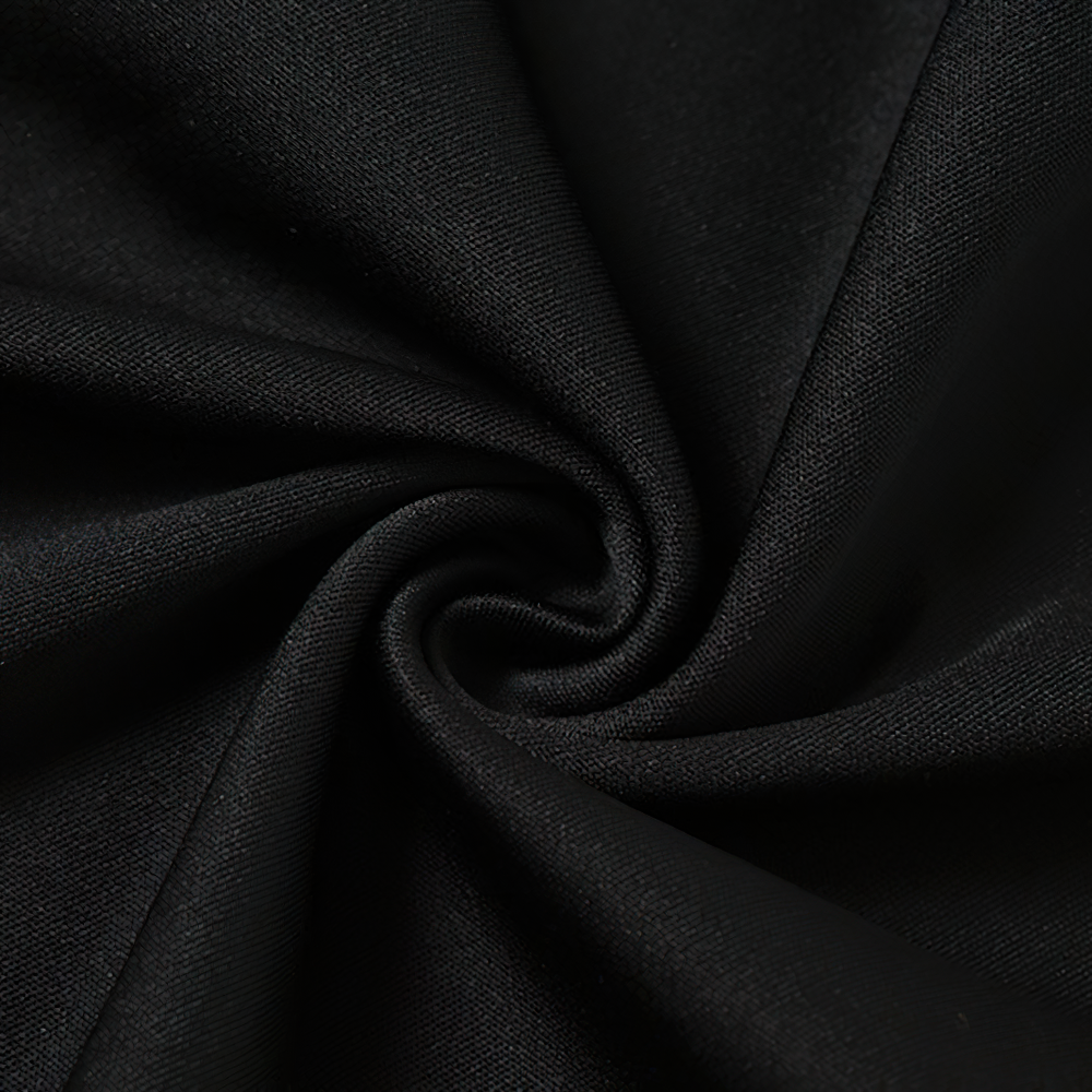 Close-up of soft black fabric showcasing smooth texture for gothic clothing designs.