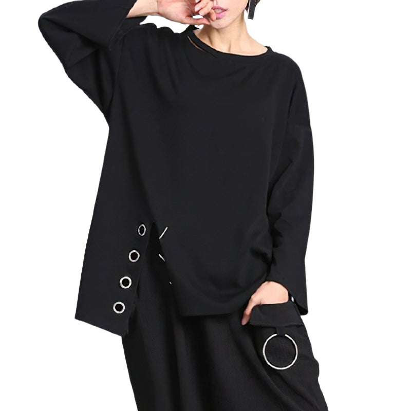 Women's black long sleeve top with unique metal details, perfect for casual outfits and warmer seasons.
