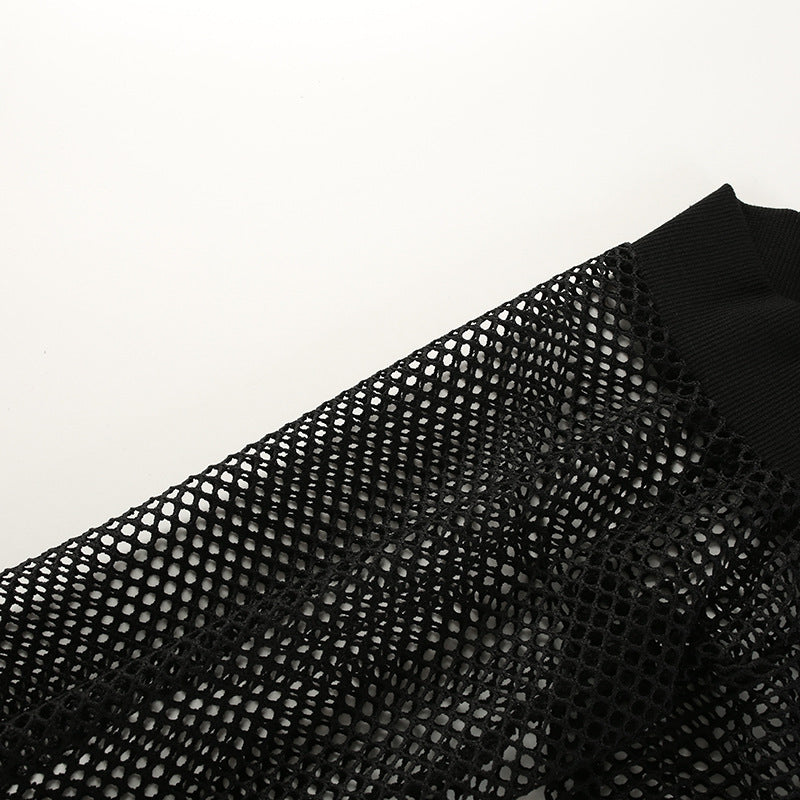 Close-up of black mesh fabric with long sleeve, showcasing intricate net design for gothic crop top.