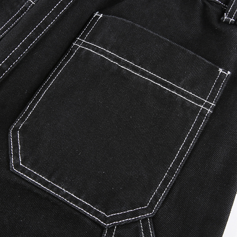 Close-up of women's black cotton pants pocket with contrasting white stitching for a stylish touch.