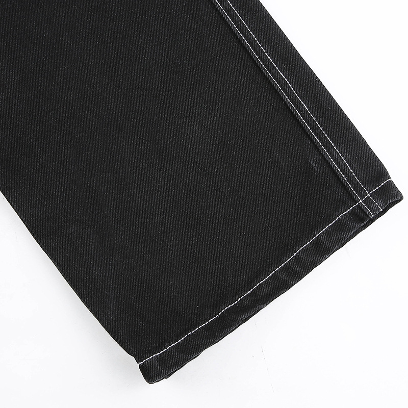 Close-up of women's black cotton streetwear pants showcasing the straight hem and high-waist design for a chic look.