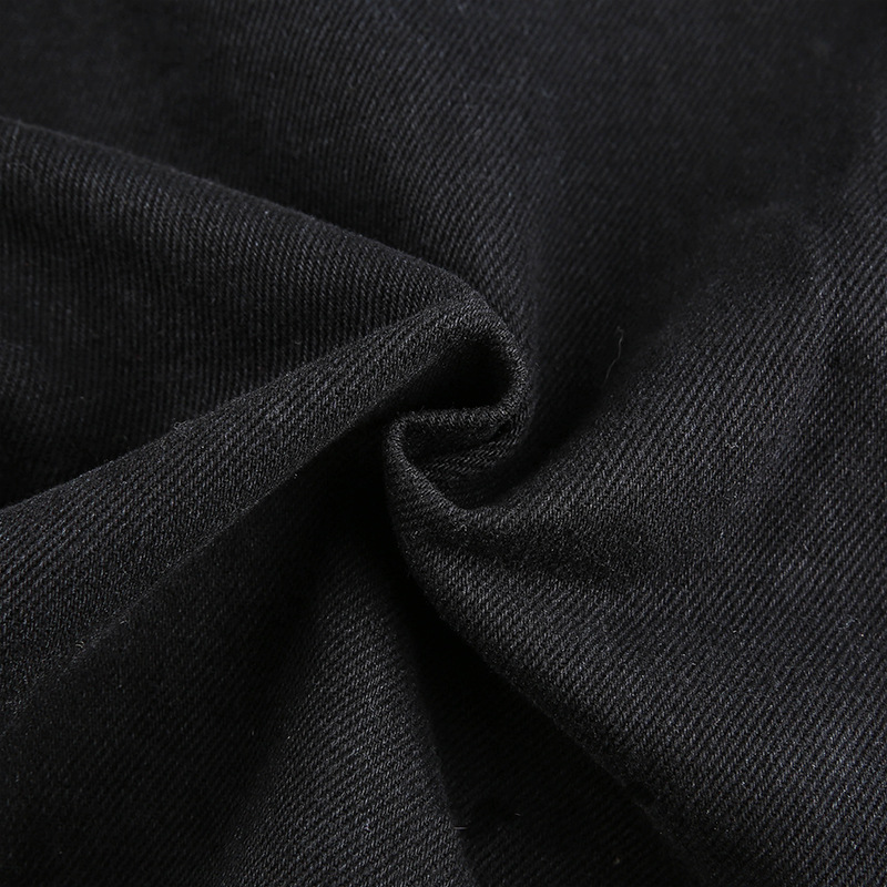 Close-up of soft black cotton fabric for women's high-waist streetwear pants, showcasing texture and quality.