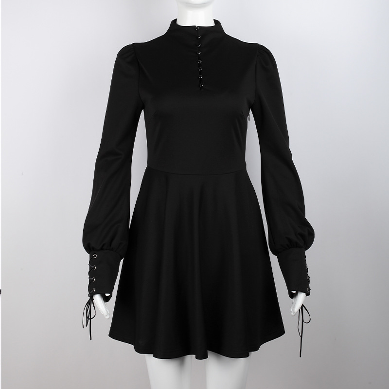 Elegant women's black pleated gothic dress with long lantern sleeves and decorative ties on sleeves.