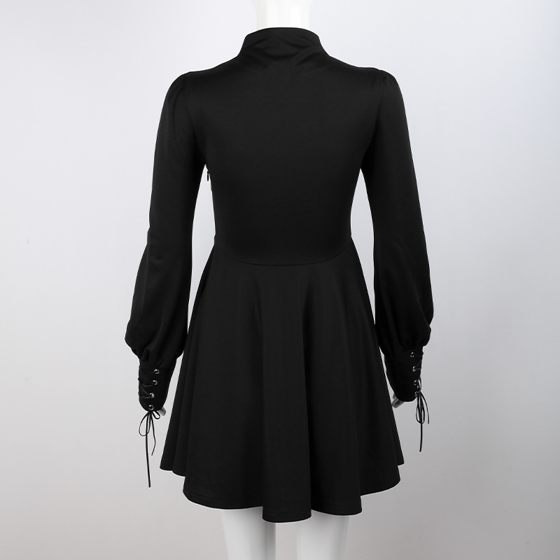 Back view of a women's black gothic-style dress with lantern sleeves and ties, showcasing a flared skirt design.