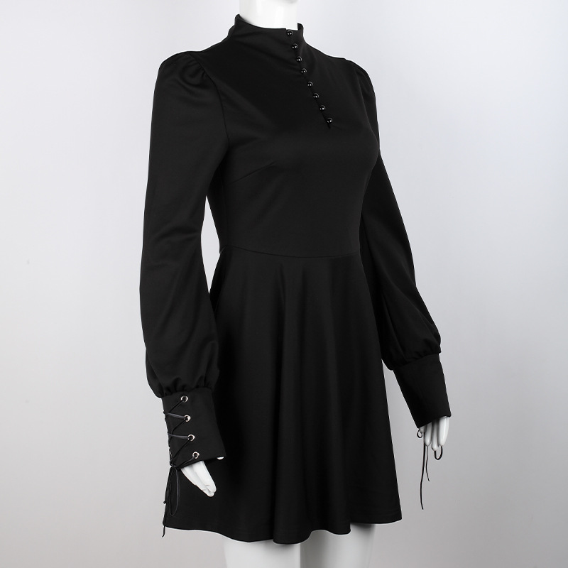 Elegant women's black pleated gothic dress with lantern sleeves and decorative ties.