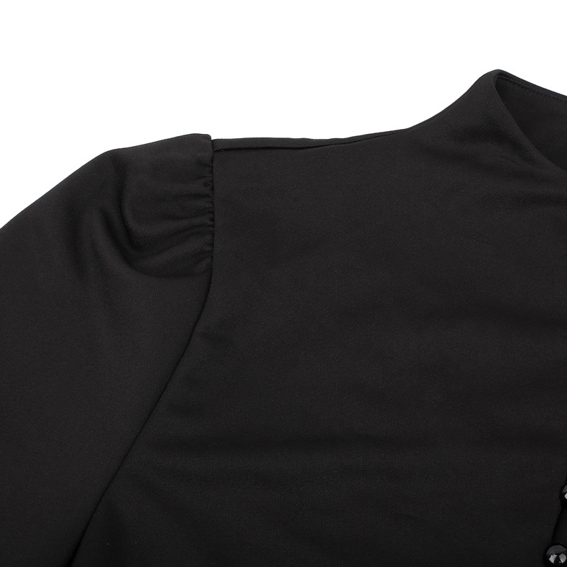 Close-up view of women's black gothic dress featuring lantern sleeve detail and buttons.