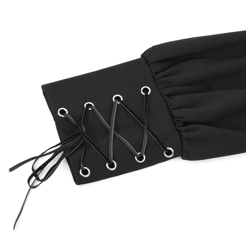 Close-up of the black pleated dress sleeve featuring decorative lace-up ties in gothic style.