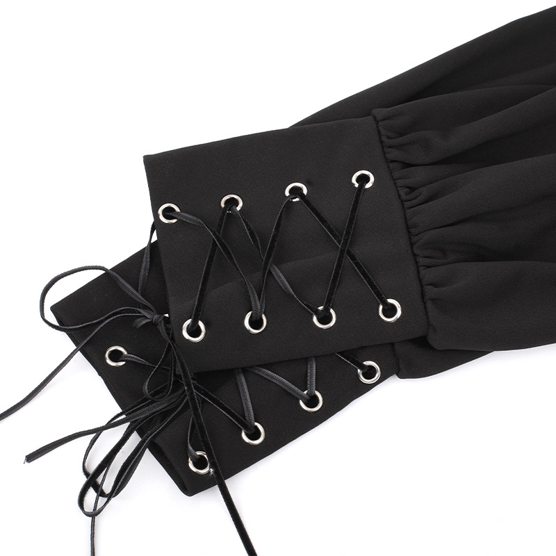 Close-up of gothic black dress sleeves featuring decorative laces and silver eyelets for an elegant look.