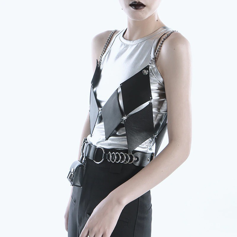Trendy women's silver and black leather tank top with chains and an edgy design, perfect for alternative fashion lovers.