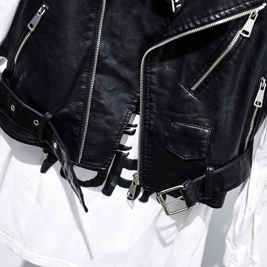 Close-up of a women's black PU leather vest with zippers and a belt, perfect for punk fashion and stylish outings.