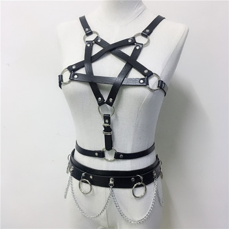 Gothic women's body harness with pentagram design, featuring leather straps and metal rings for a bold, edgy style.