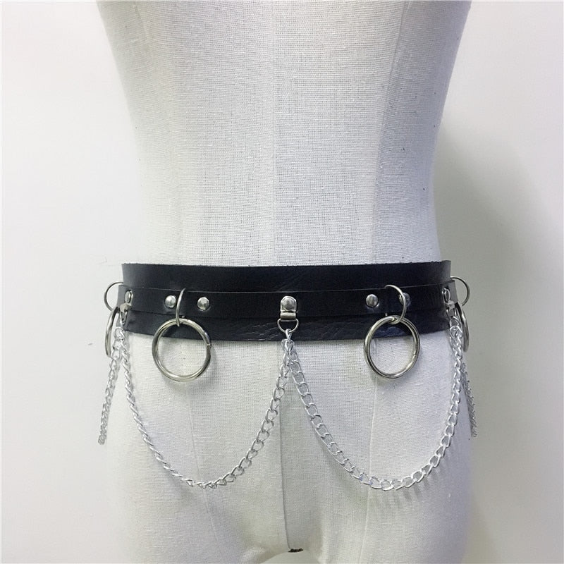 Stylish black body harness with silver chains and rings, perfect for gothic fashion and edgy outfits.