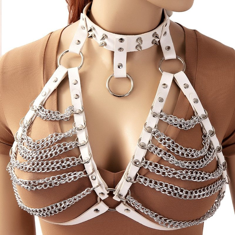 Gothic women's chest harness with metal chains and spikes in white, perfect for daring style lovers.