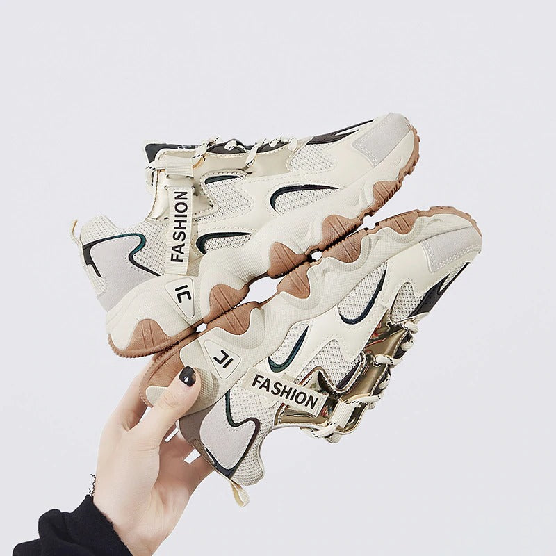 Stylish women's chunky sneakers in beige and black, perfect for casual outings and denim outfits.
