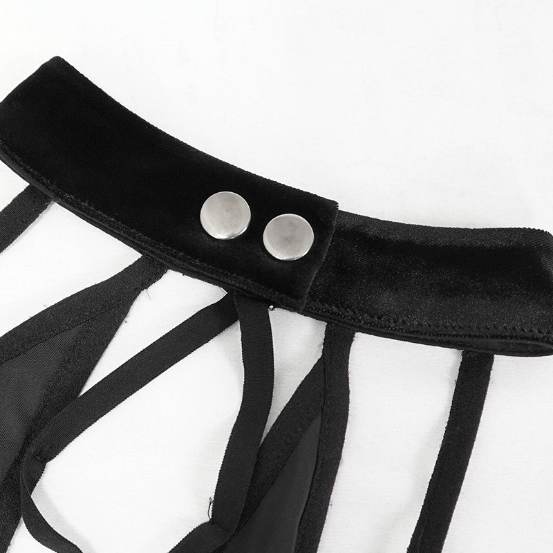 Close-up of a stylish black crop top featuring a crossed front design and button details, perfect for a gothic look.