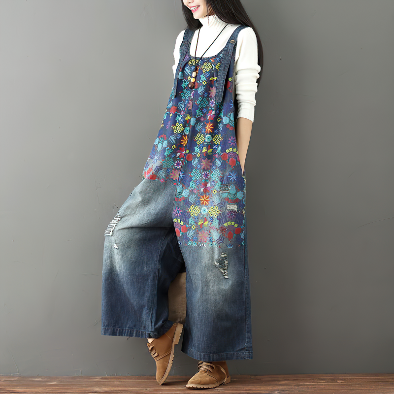 Women's floral print vintage denim jumpsuit with wide legs, showcasing a unique distressed style.