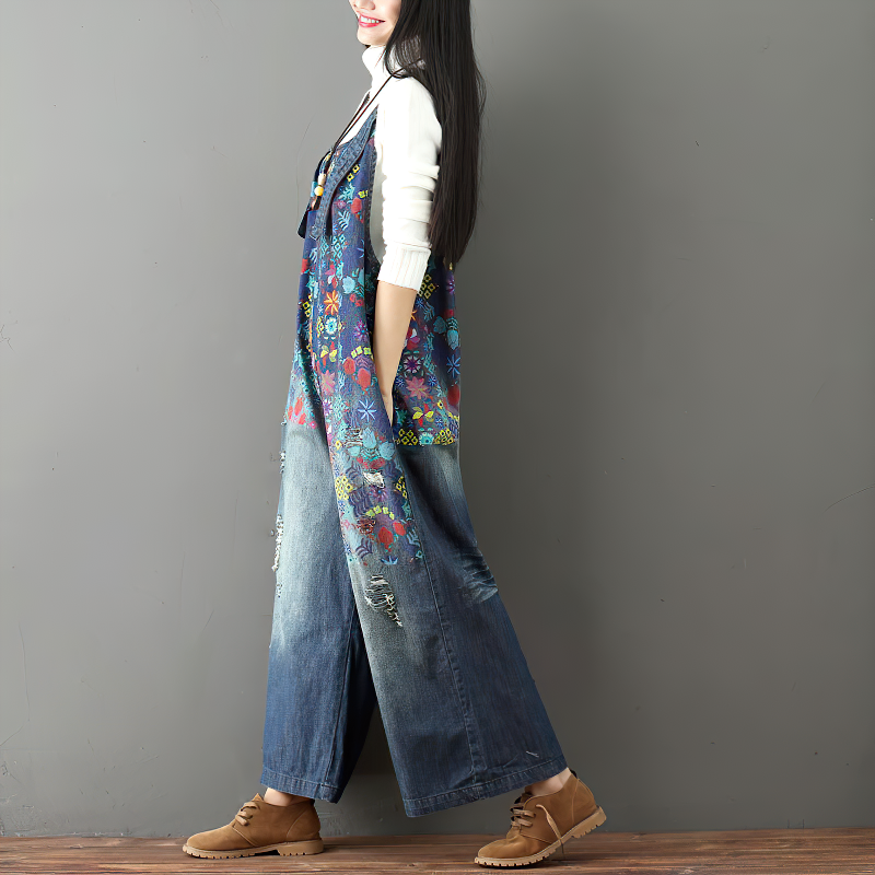 Woman in vintage floral print denim wide-leg pants showcasing stylish fashion in light blue.