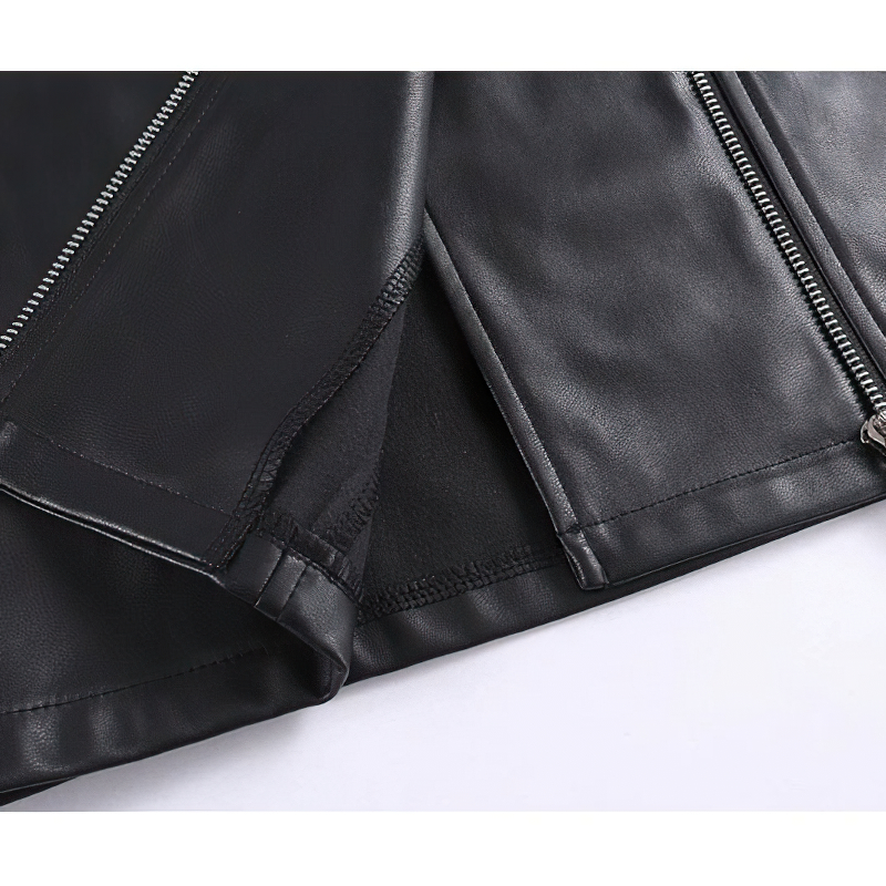 Close-up of black PU leather dress showcasing elegant cut and silver zipper details for a rock-inspired style.