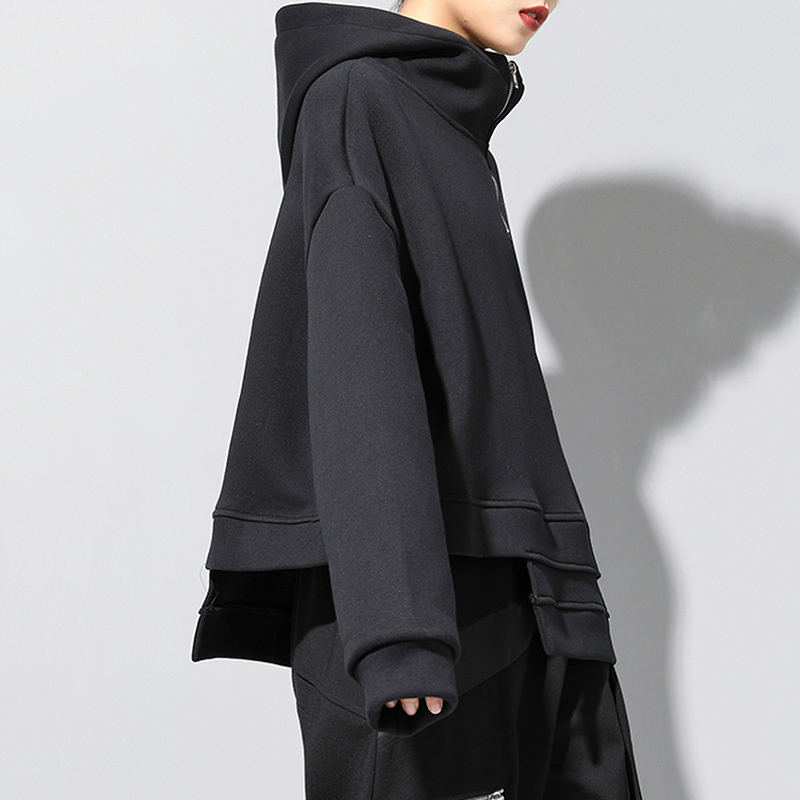 Women's oversized black double layer drawstring sweatshirt with hood and stylish design.