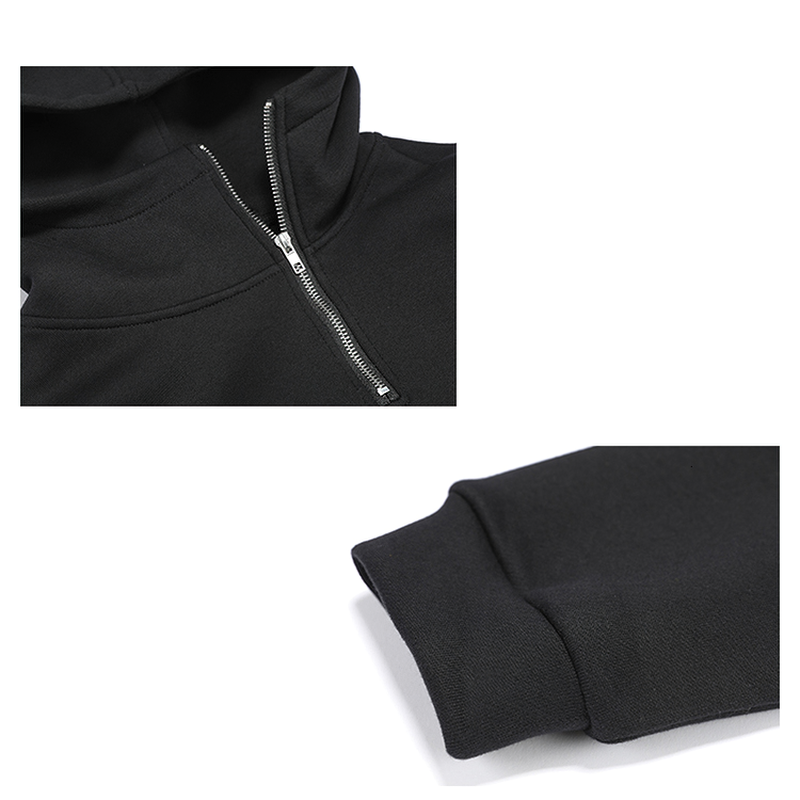 Close-up of women's black hooded sweatshirt showcasing zipper detail and loose cuff, perfect for style and comfort.