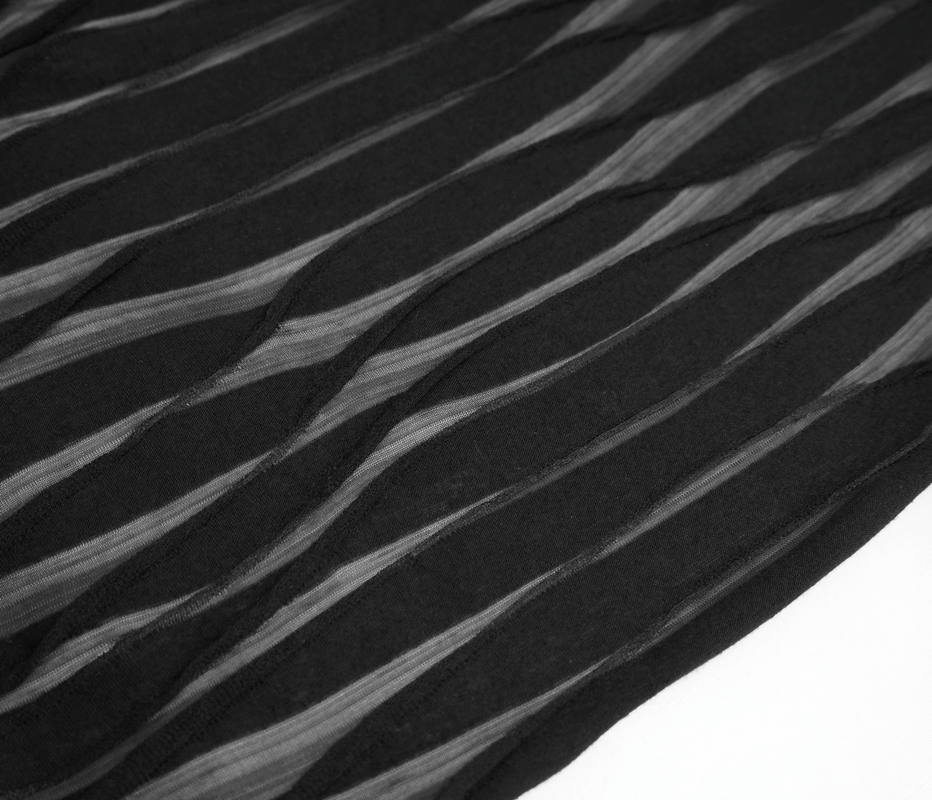 Close-up of black fabric with wavy textured stripes, showcasing unique design for women's hoodie.