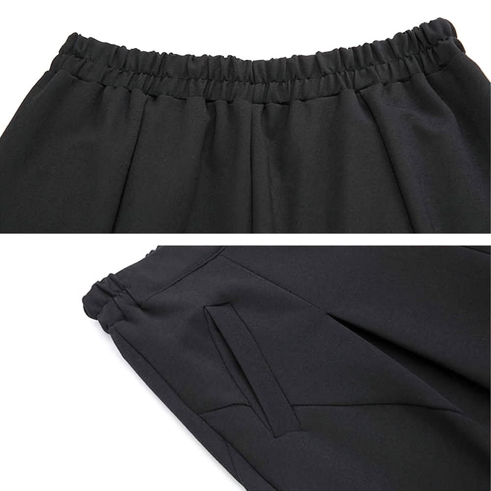 Close-up of high waist black harem trousers showcasing elastic waistband and side pockets for comfort and style.
