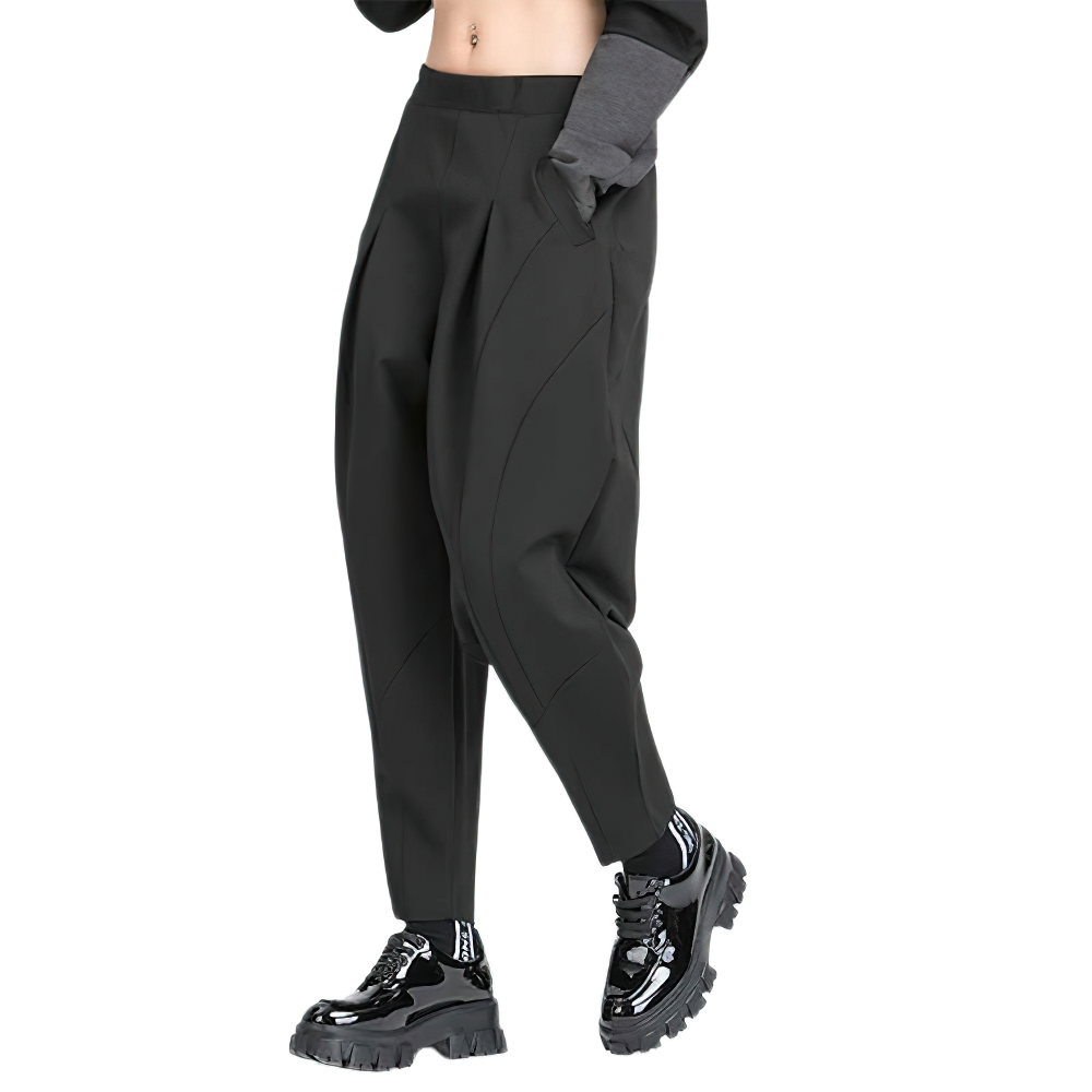 High waist black harem trousers, loose fit, paired with stylish sneakers, perfect for casual outings.