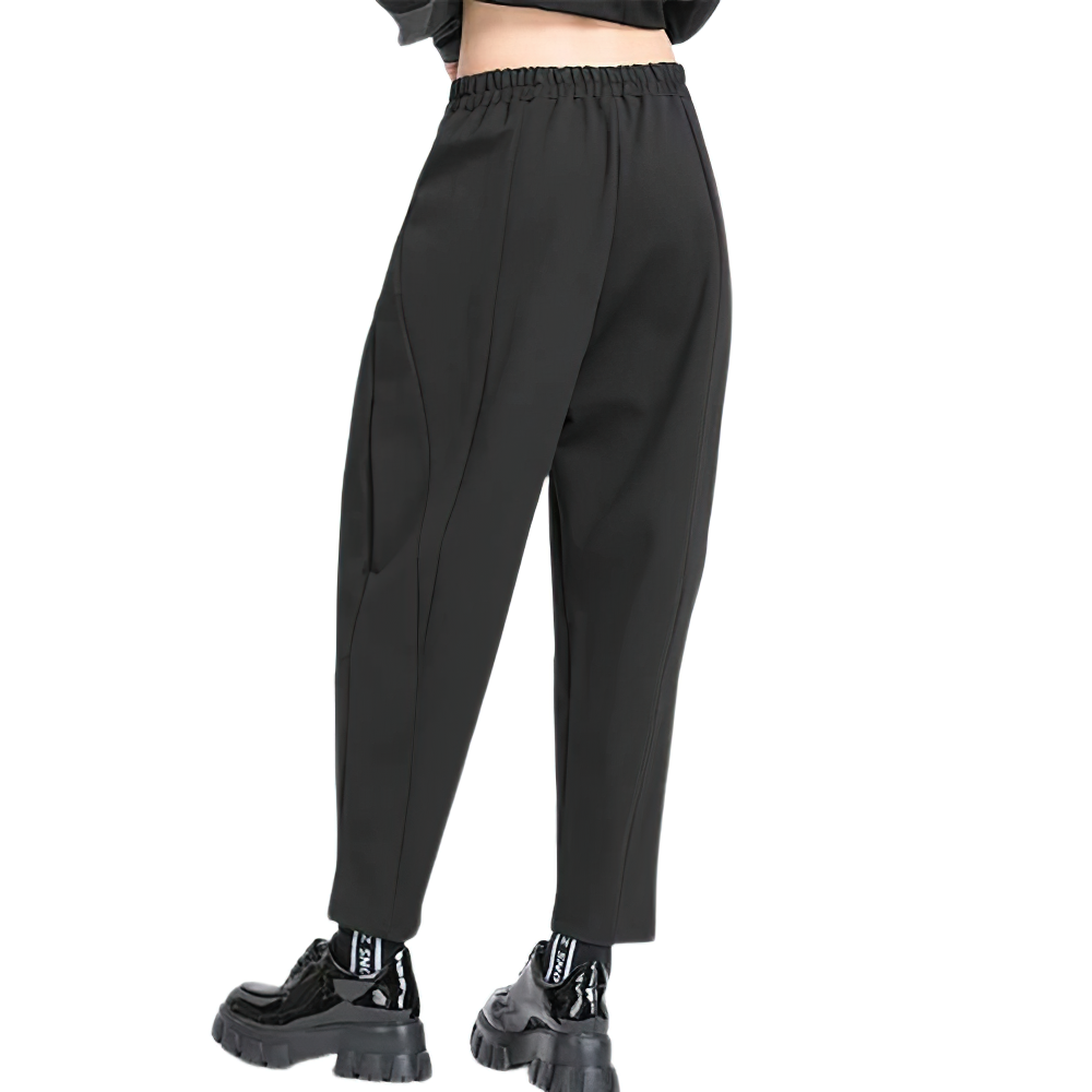 Back view of women's high waist black harem trousers with elastic waist, perfect for casual outings or comfortable days.
