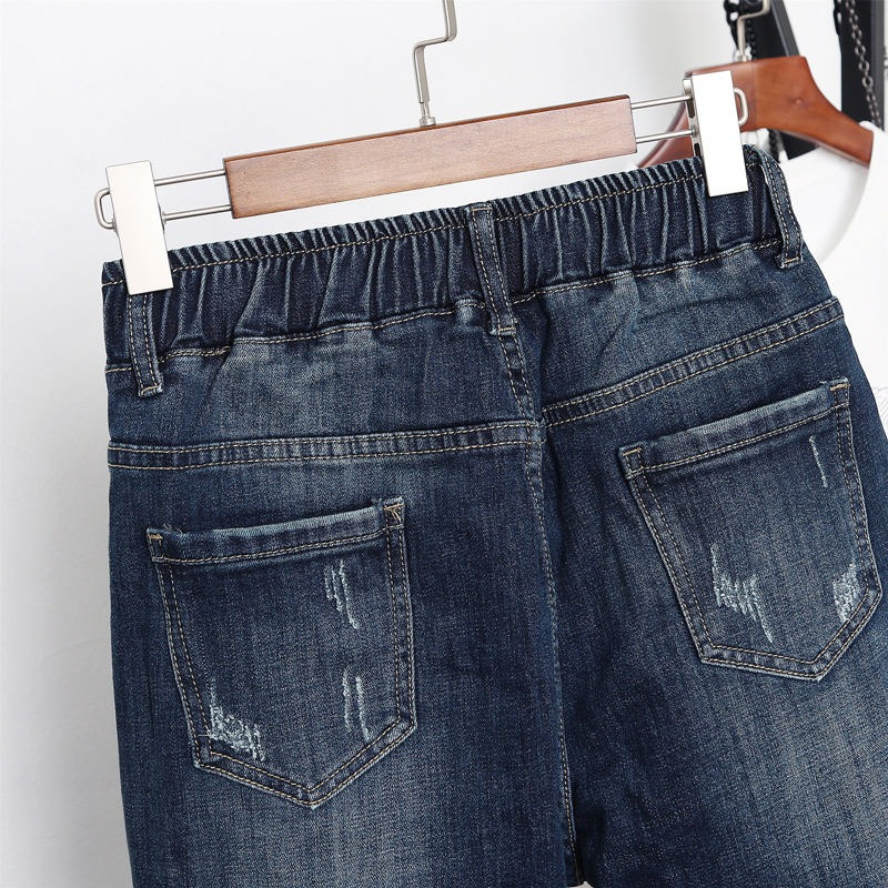 Women's loose jeans with an elastic waist, blue denim, featuring pockets and distressed details, perfect for streetwear.