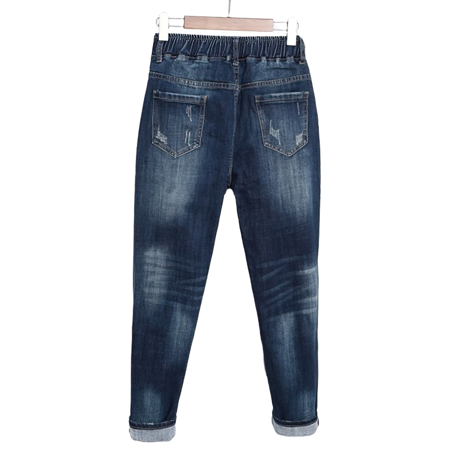 Back view of women's blue loose jeans with elastic waistband and pockets, perfect for casual streetwear.