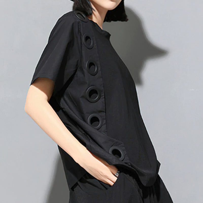 Trendy black women's round neck t-shirt featuring unique hollow out decoration for a stylish look.